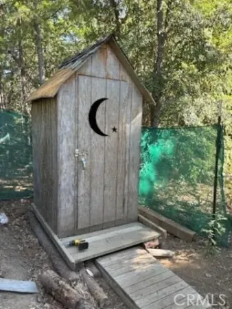 a view of swimming pool with large trees