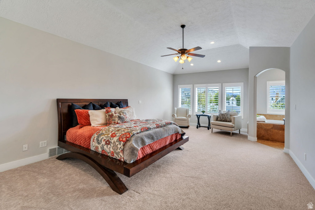 1355 West 1000 South Mapleton, UT 84664 - Photo 17 of 74 Bedroom with a ceiling fan, light colored carpet, and arched walkways