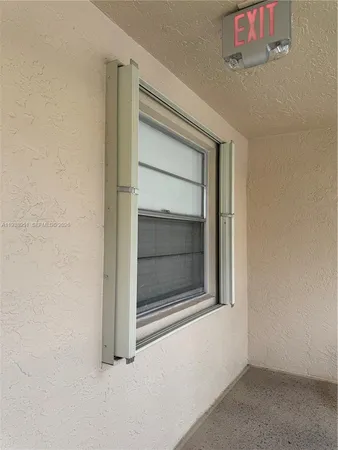 a kitchen with granite countertop a stove and a microwave