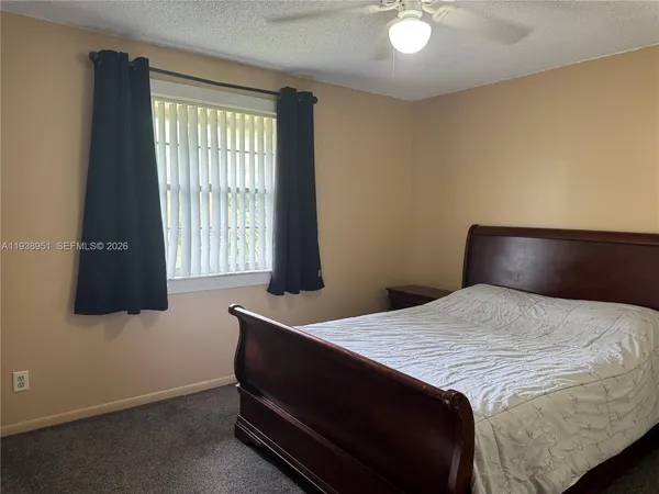 a kitchen with stainless steel appliances a stove a microwave and a refrigerator