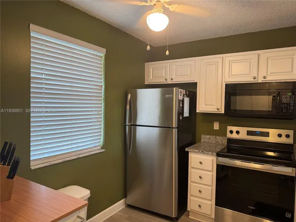 a view of room with window and entryway
