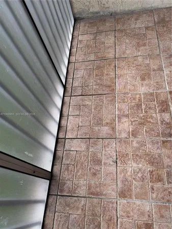 a lobby with furniture and a rug