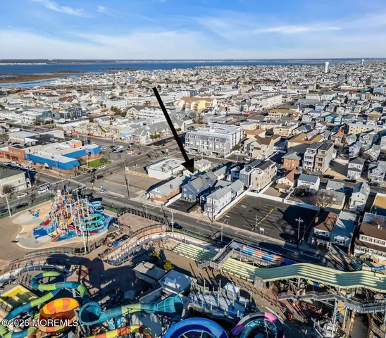 a couple of cars parked in front of a house