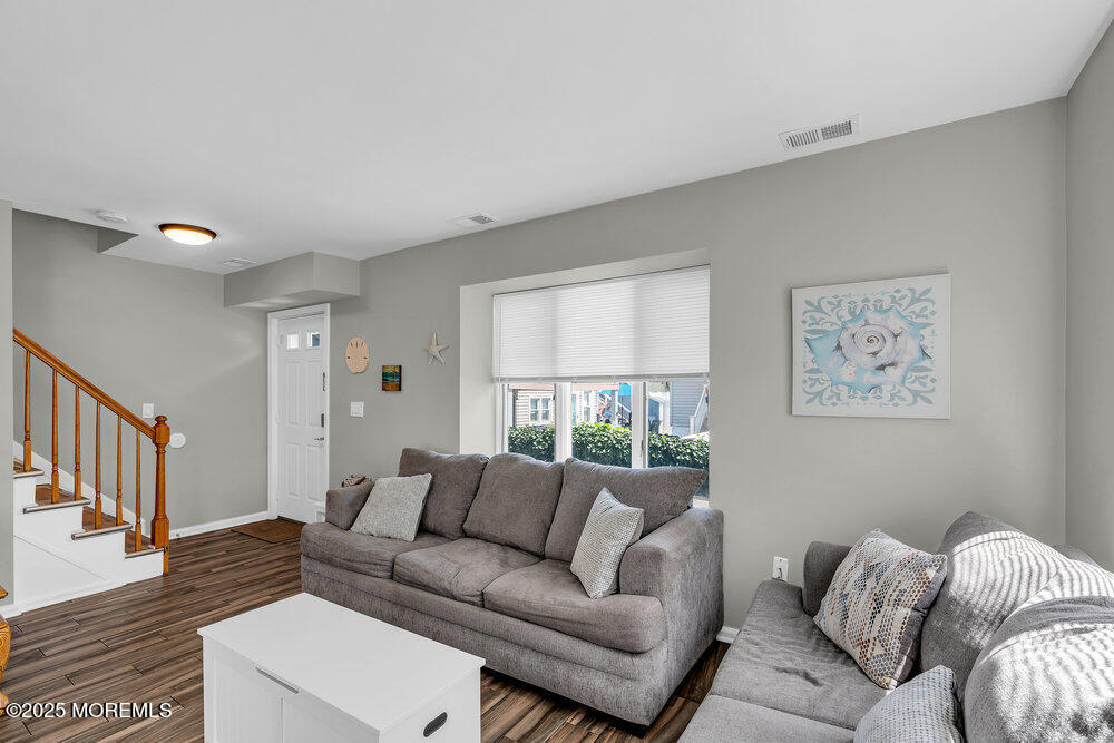 62 Sherman Avenue, Unit A1 Seaside Heights, NJ 08751 - Photo 5 of 17 a living room with furniture and a window
