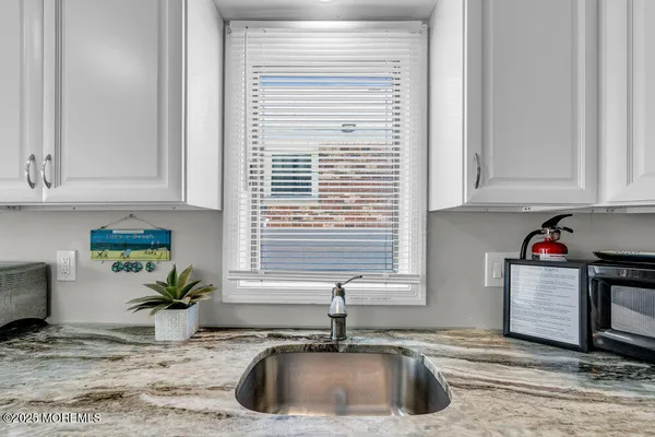 a utility room with closet dryer and washer