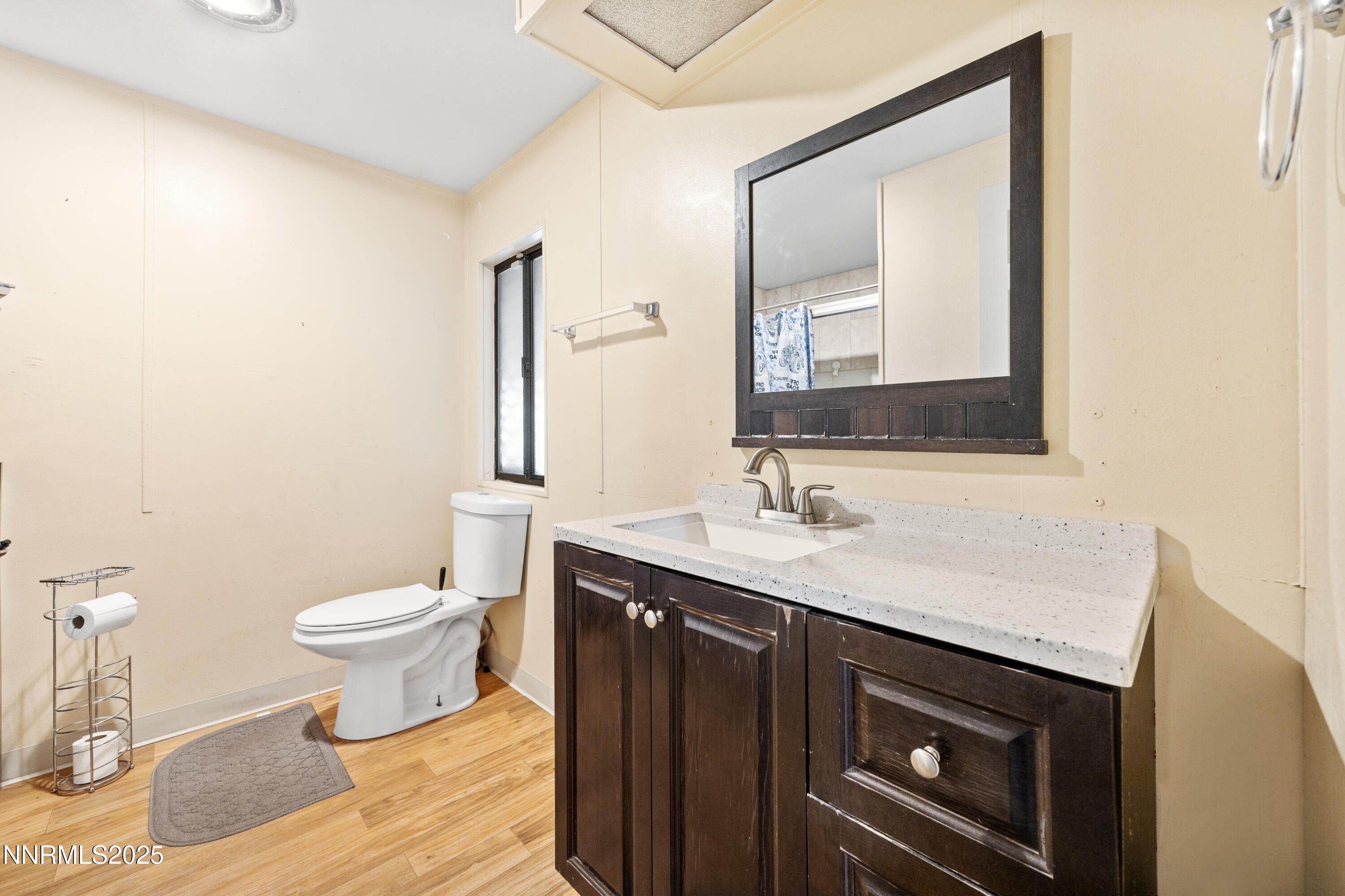 2735 Daffodil Way Reno, NV 89512 - Photo 20 of 23 a bathroom with a sink toilet and mirror