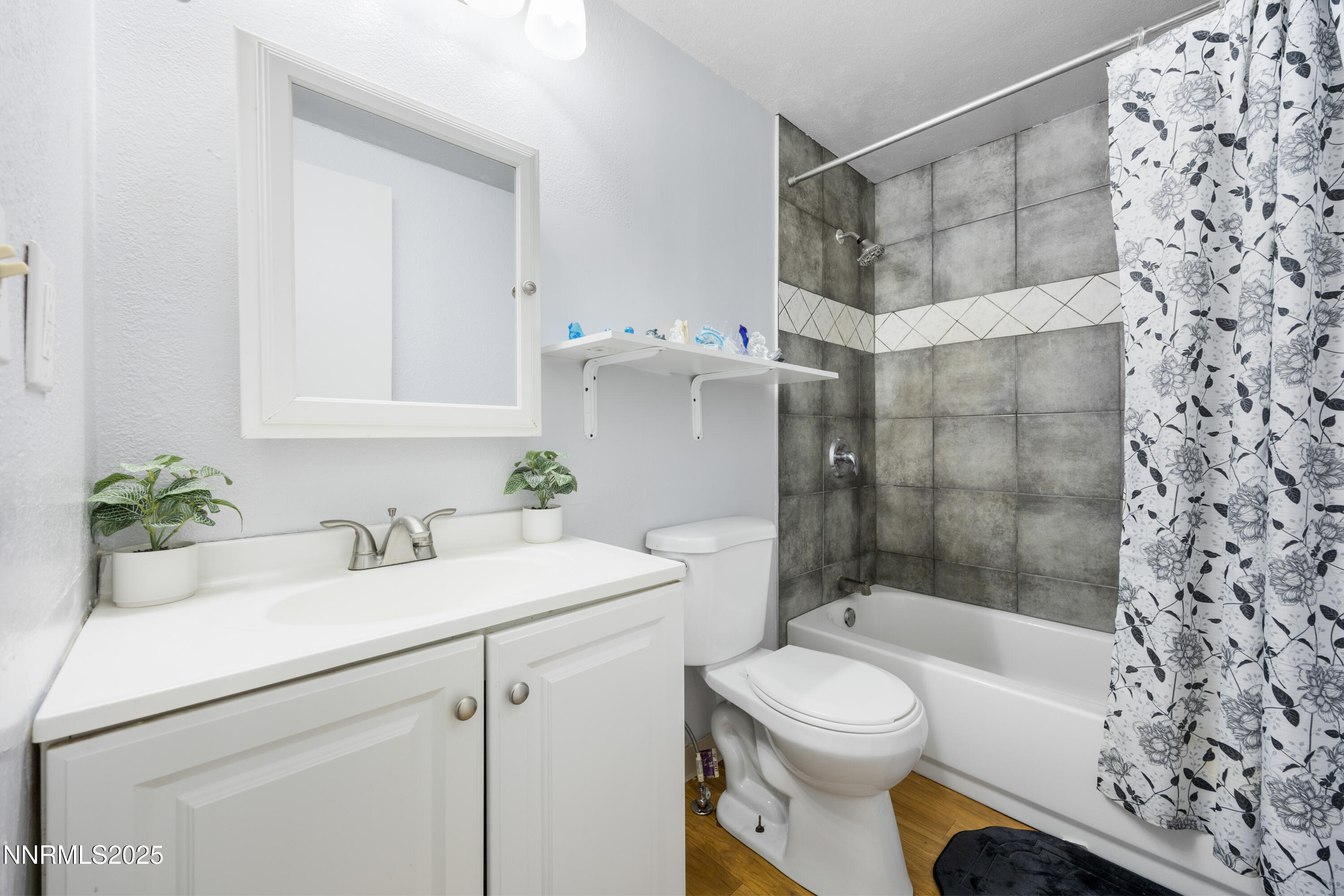 2735 Daffodil Way Reno, NV 89512 - Photo 21 of 23 a bathroom with a sink toilet and shower