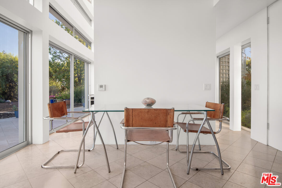 21839 Saddle Peak Road Topanga, CA 90290 - Photo 12 of 72 a view of a room with a table and chairs