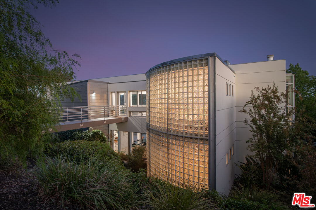 21839 Saddle Peak Road Topanga, CA 90290 - Photo 2 of 72 a front view of a house with a garden
