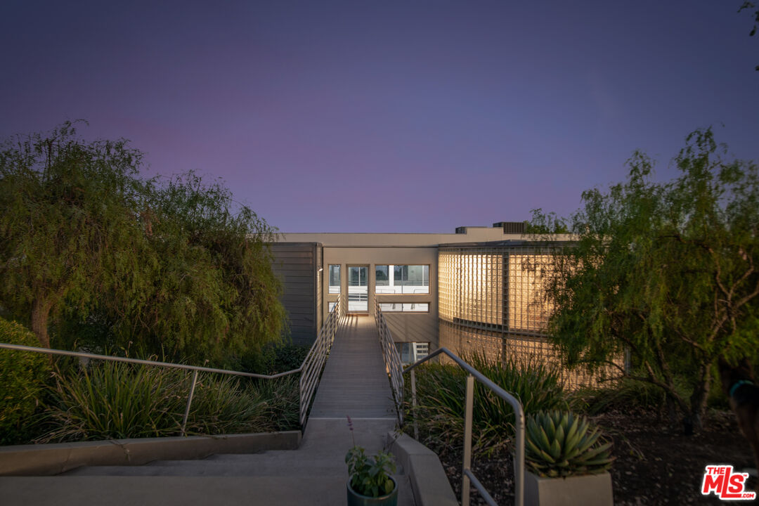 21839 Saddle Peak Road Topanga, CA 90290 - Photo 43 of 72 a front view of a house with a yard