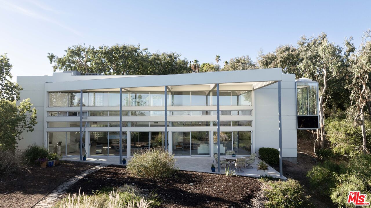 21839 Saddle Peak Road Topanga, CA 90290 - Photo 53 of 72 a front view of a house with a garden