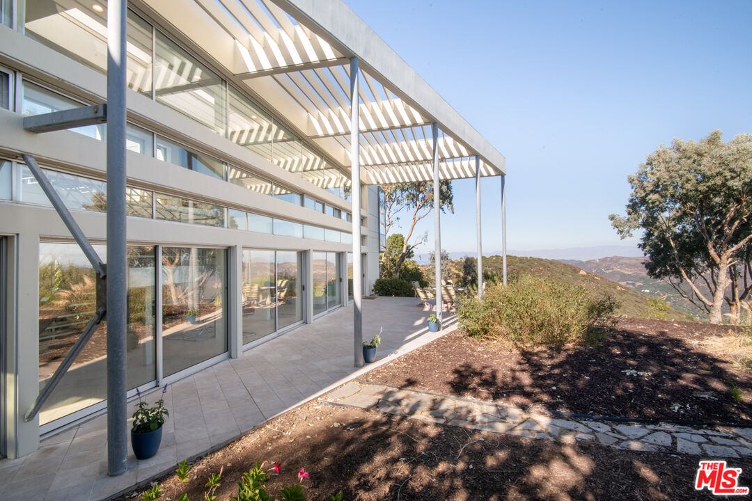 21839 Saddle Peak Road Topanga, CA 90290 - Photo 58 of 72 a view of a pathway along a building