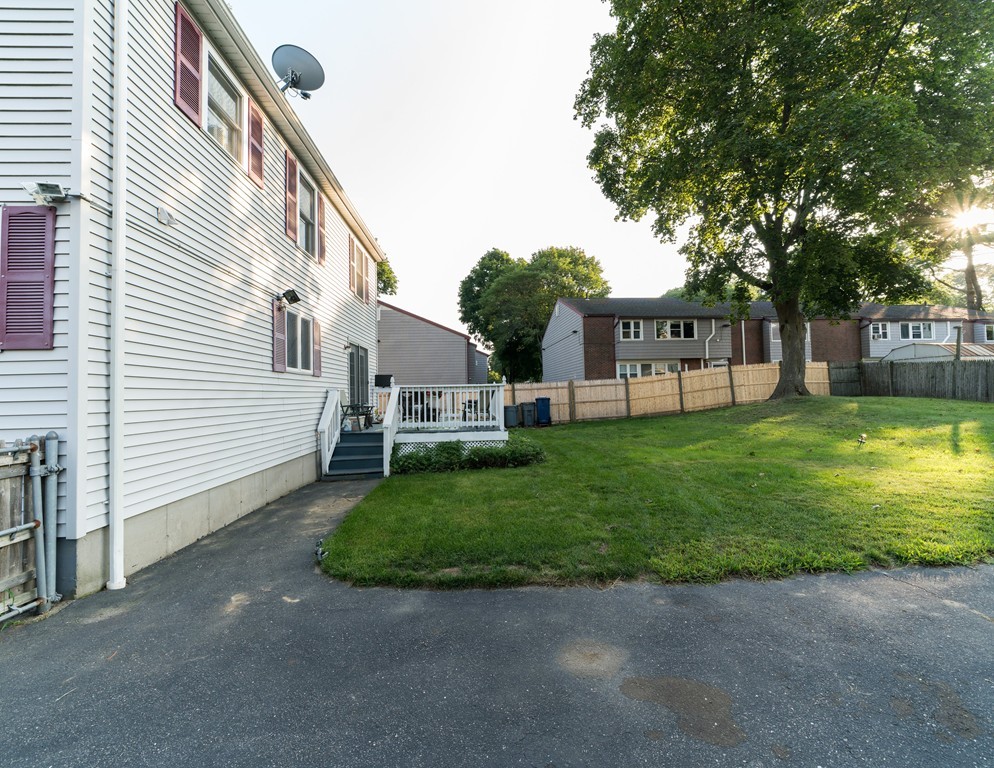 116 Pierce Street Boston, MA 02136 - Photo 14 of 18 a view of a backyard with a garden