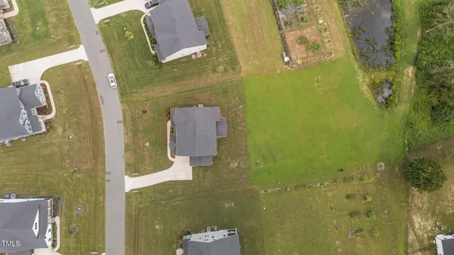 an aerial view of a house with a ocean view