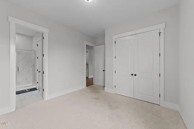 a bathroom with a sink a light fixture and a toilet
