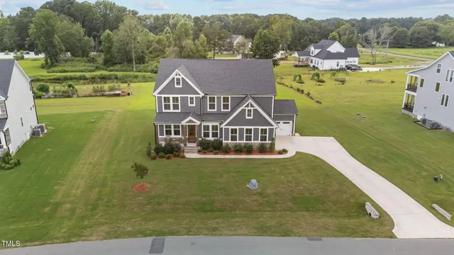 an aerial view of a house with a garden