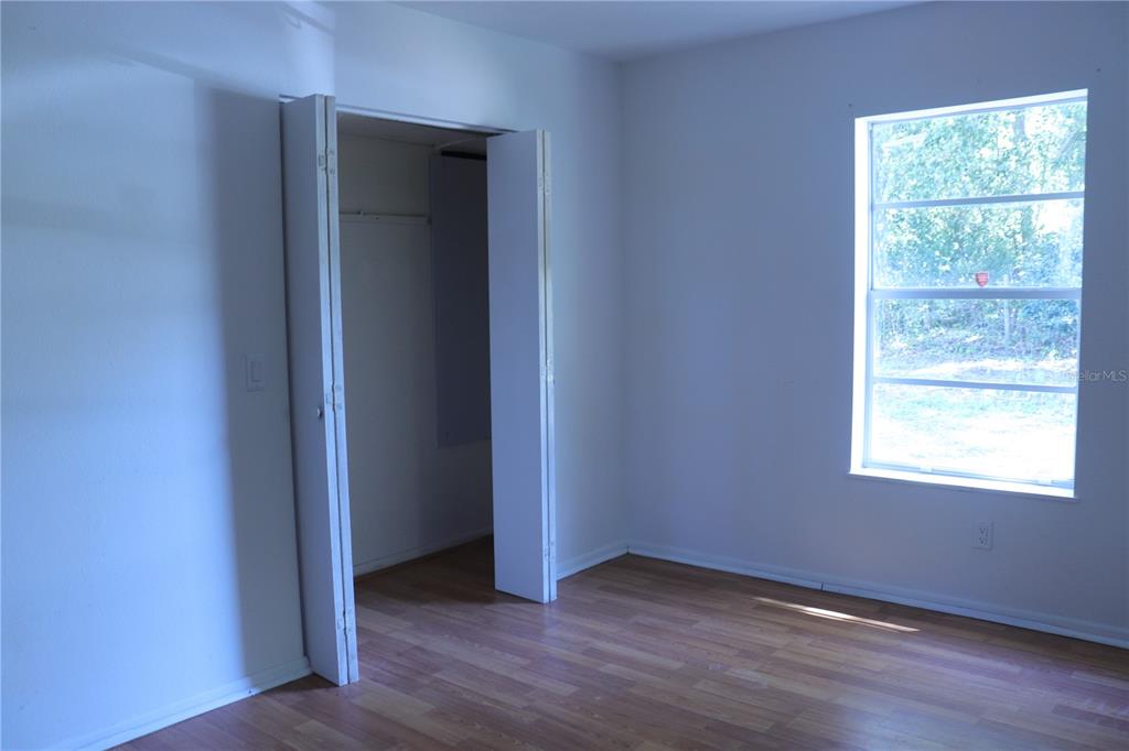 19791 Southwest 108th Lane Dunnellon, FL 34432 - Photo 11 of 19 an empty room that has a window