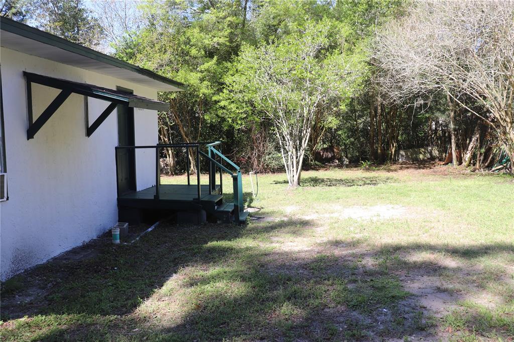 19791 Southwest 108th Lane Dunnellon, FL 34432 - Photo 12 of 19 a view of a yard with a tree