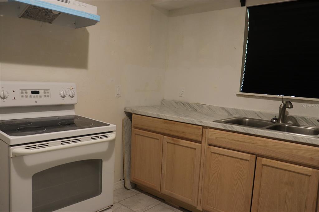 19791 Southwest 108th Lane Dunnellon, FL 34432 - Photo 15 of 19 a kitchen with granite countertop cabinets stainless steel appliances and a sink