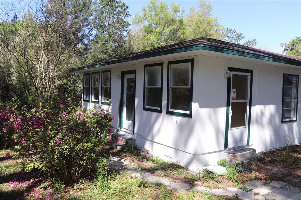 19791 Southwest 108th Lane Dunnellon, FL 34432 - Photo 3 of 19 a front view of a house with a yard