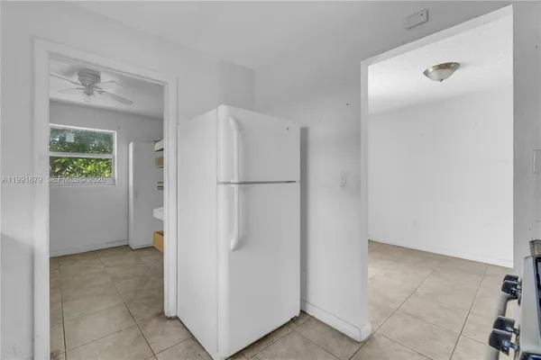 a view of room with window and hardwood floor