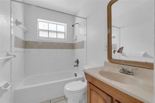 a bathroom with a sink toilet and bathtub