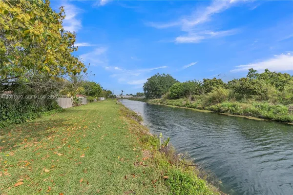 an aerial view of residential houses with city view