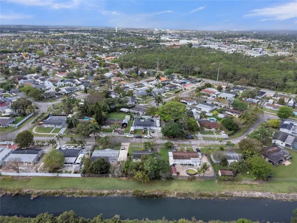 an aerial view of city and green space