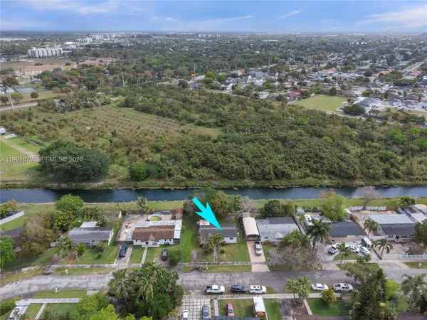 an aerial view of a house with a lake view
