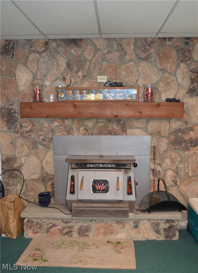 68 Haynes Road Little Hocking, OH 45742 - Photo 29 of 35 Wood stove in the Rec Room.