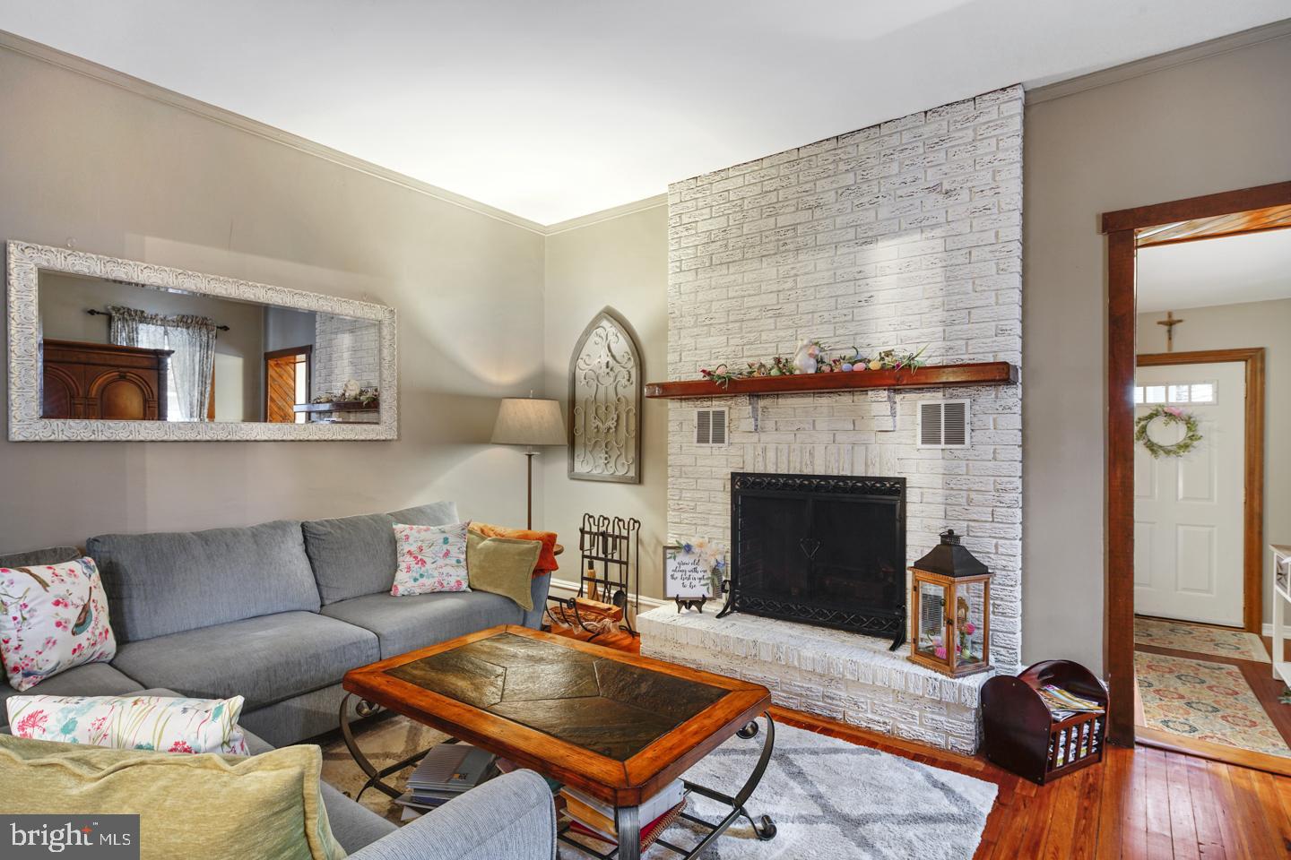 Hardwood flooring, high ceilings & baseboards.