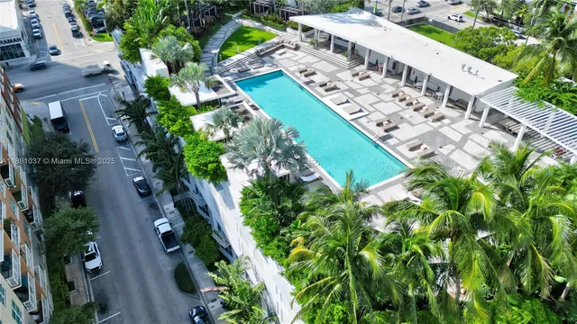 an aerial view of a house with a garden and plants