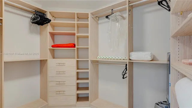 a spacious bedroom with a bed and a couch