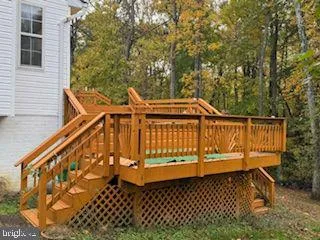 a view of outdoor space with deck and yard