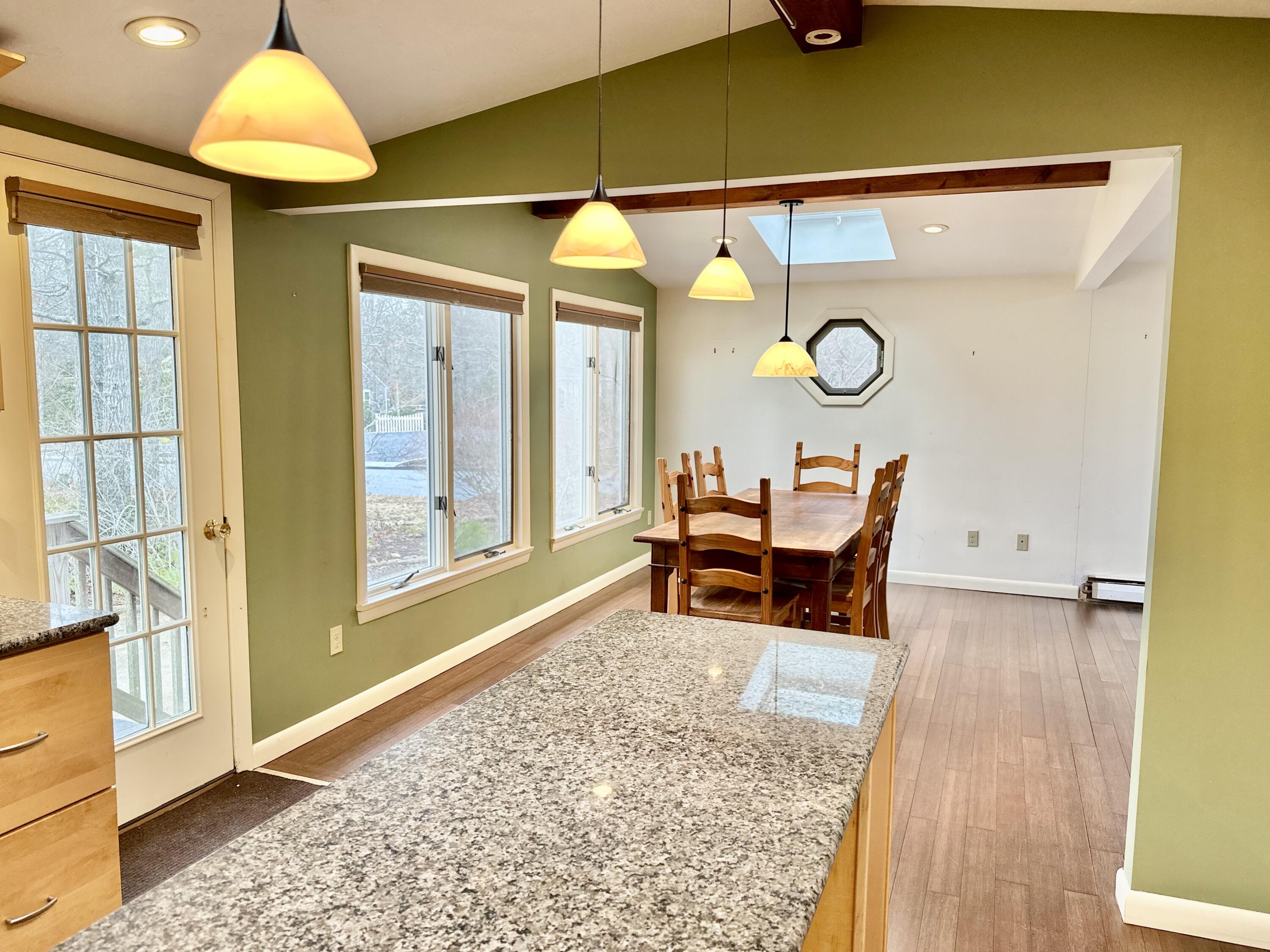 217 Freemans Way Brewster, MA 02631 - Photo 26 of 57 a view of a room with a table and chairs