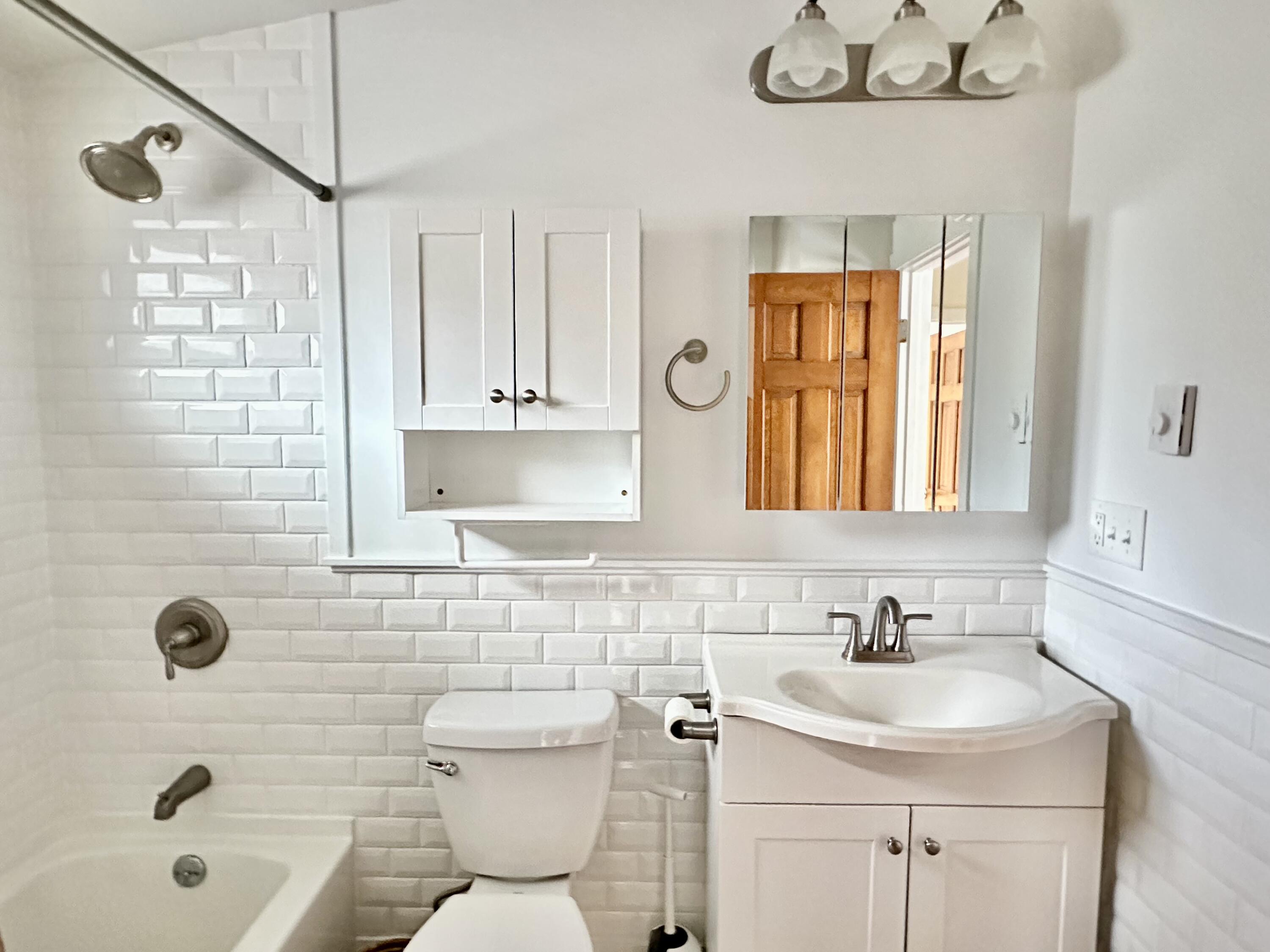 217 Freemans Way Brewster, MA 02631 - Photo 32 of 57 a bathroom with a sink a toilet and shower