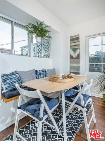 a view of a dining table and chairs in a room