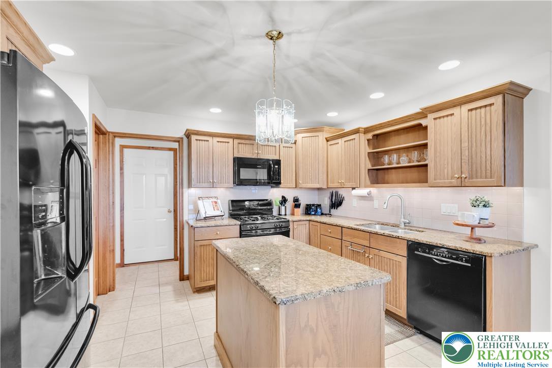 461 East Beil Avenue Nazareth, PA 18064 - Photo 14 of 64 a kitchen with stainless steel appliances granite countertop a sink stove and refrigerator