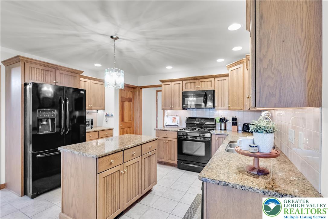 461 East Beil Avenue Nazareth, PA 18064 - Photo 15 of 64 a kitchen with a sink stove and refrigerator