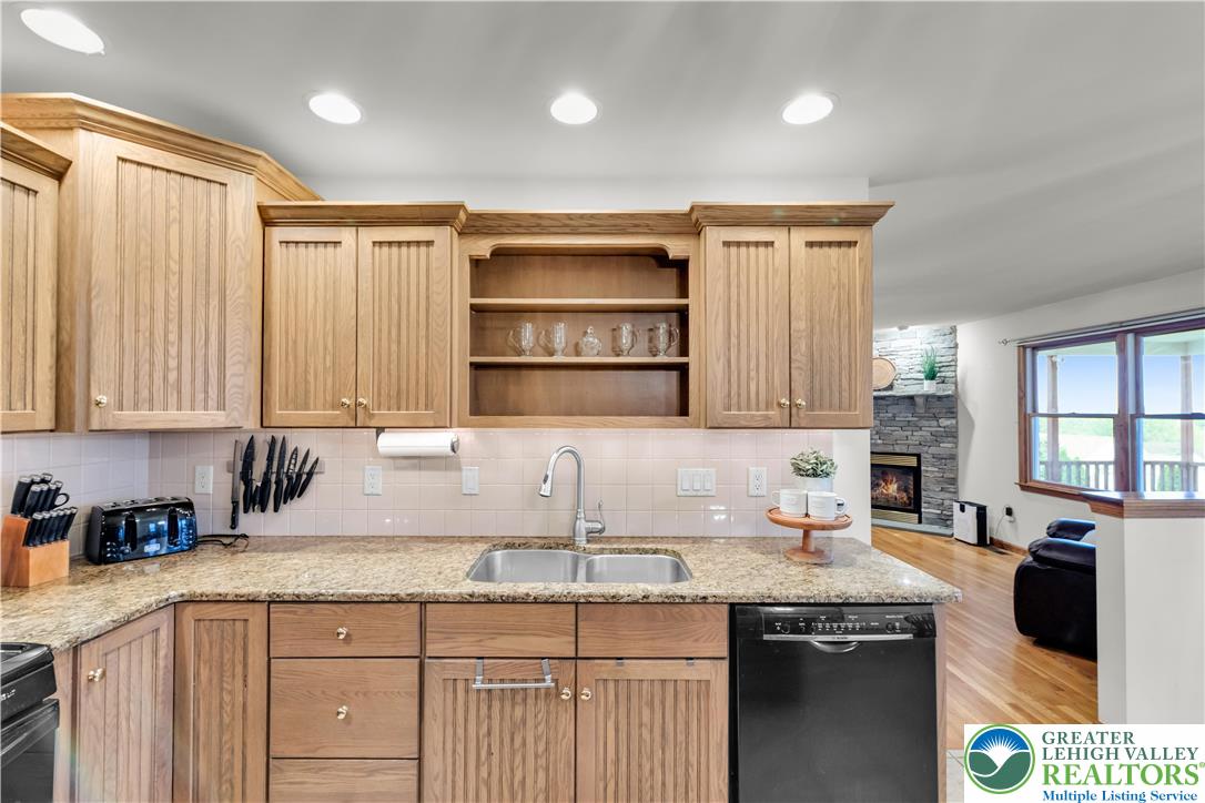 461 East Beil Avenue Nazareth, PA 18064 - Photo 19 of 64 a kitchen with granite countertop a sink a counter space appliances and cabinets