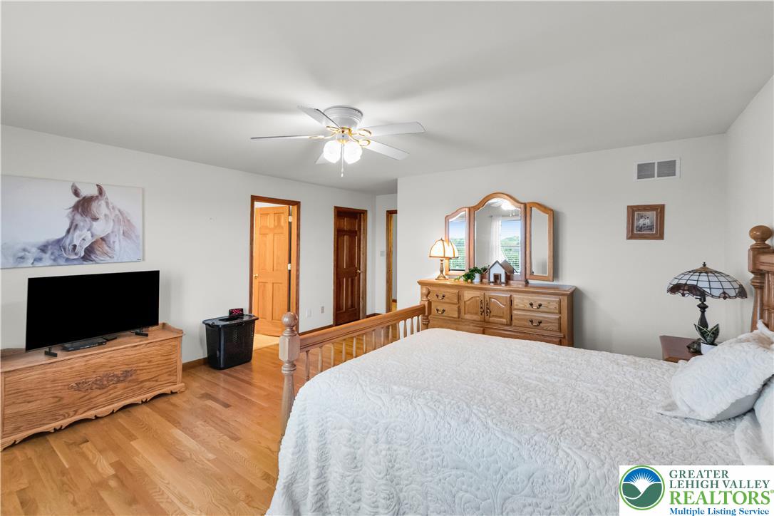 461 East Beil Avenue Nazareth, PA 18064 - Photo 27 of 64 a bedroom with a bed and a flat screen tv