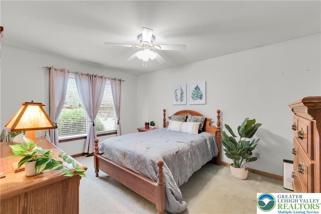 461 East Beil Avenue Nazareth, PA 18064 - Photo 29 of 64 a bedroom with a bed and chandelier