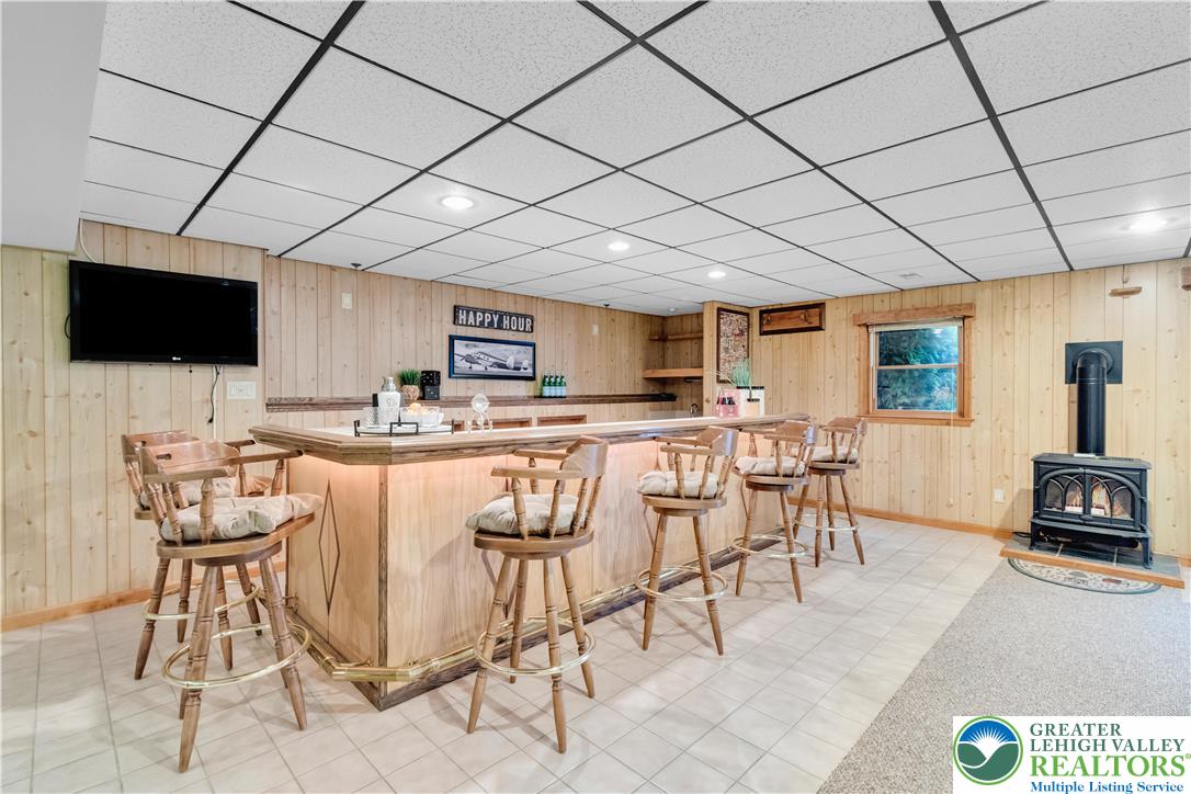 461 East Beil Avenue Nazareth, PA 18064 - Photo 43 of 64 a living room with furniture a flat screen tv and kitchen view