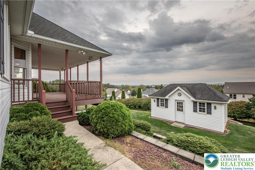461 East Beil Avenue Nazareth, PA 18064 - Photo 6 of 64 a view of a white house next to a yard with potted plants