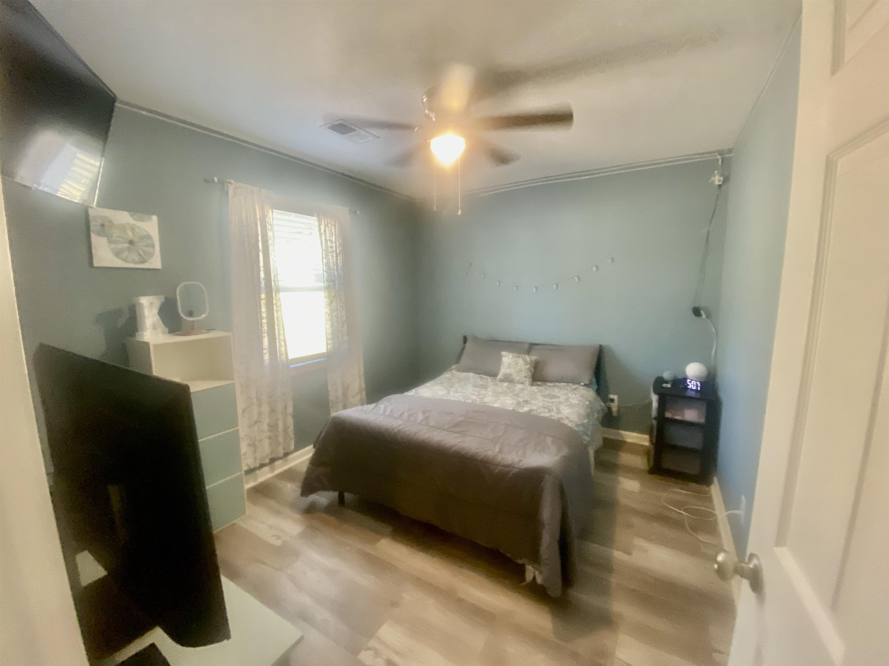 465 Post Office Road Michie, TN 38357 - Photo 6 of 11 Bedroom with ceiling fan and light wood-type flooring