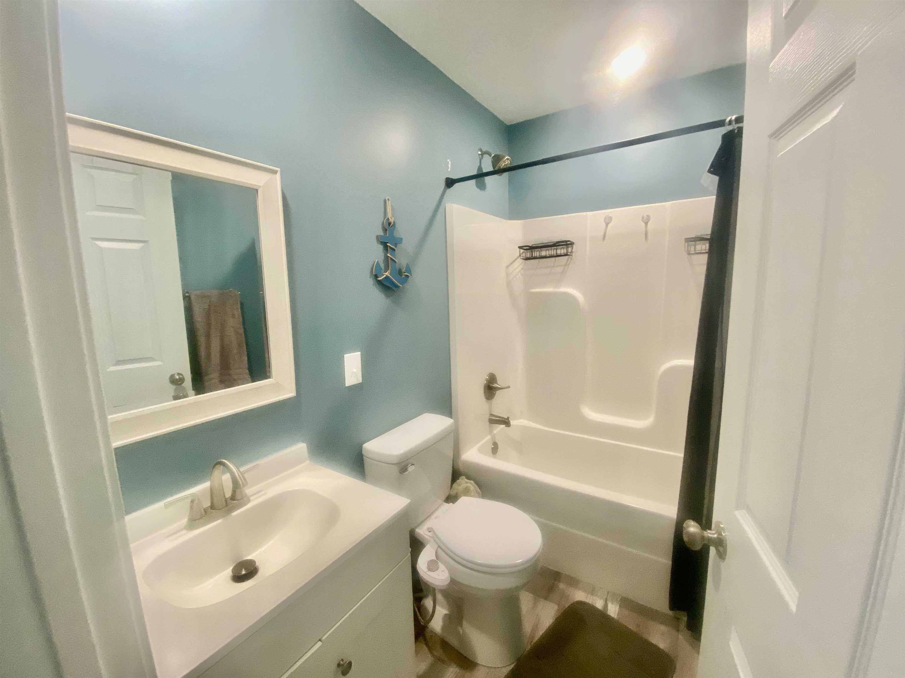 465 Post Office Road Michie, TN 38357 - Photo 7 of 11 Full bathroom featuring toilet, vanity, and shower / bath combination