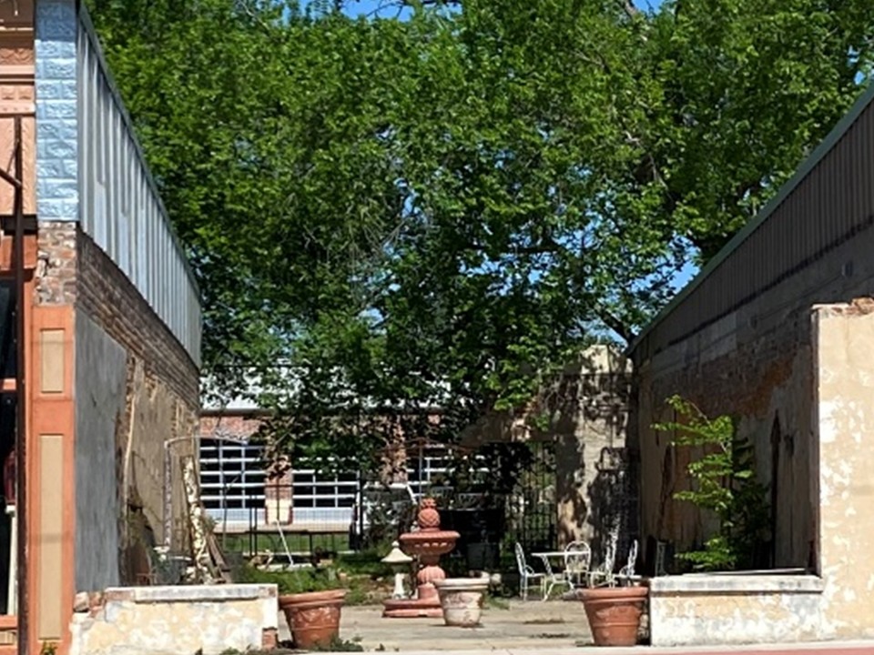 720 South Main Calvert, TX 77837 - Photo 11 of 22 a view of a building with a tree