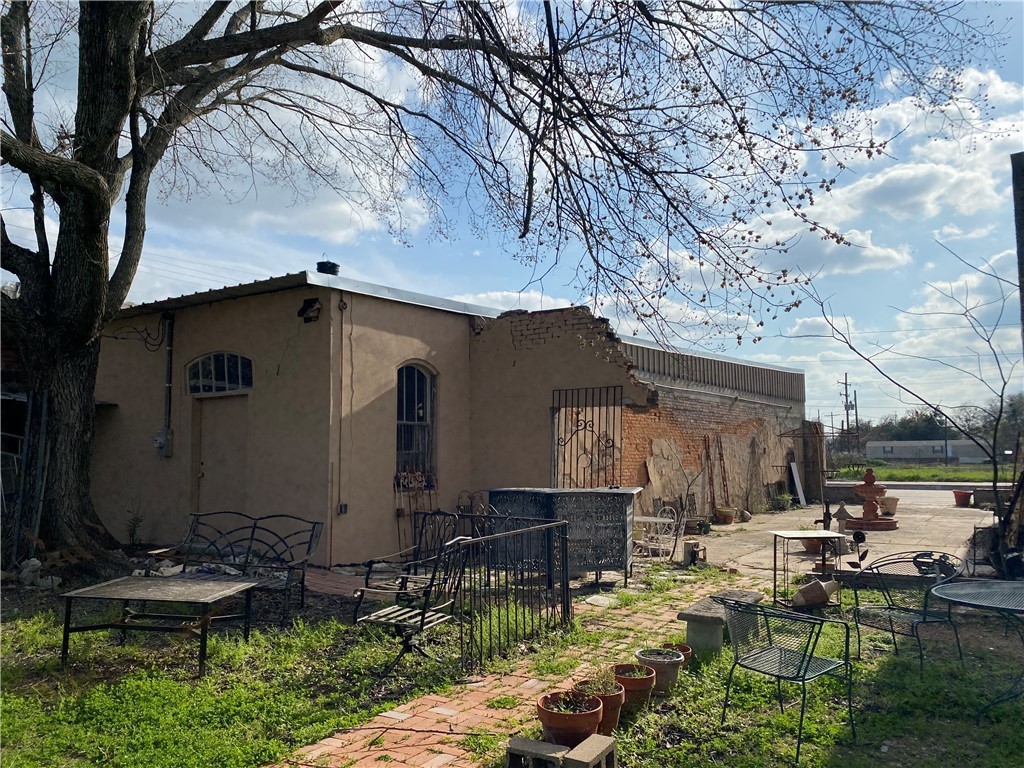 720 South Main Calvert, TX 77837 - Photo 15 of 22 a backyard of a house with yard fire pit and outdoor seating