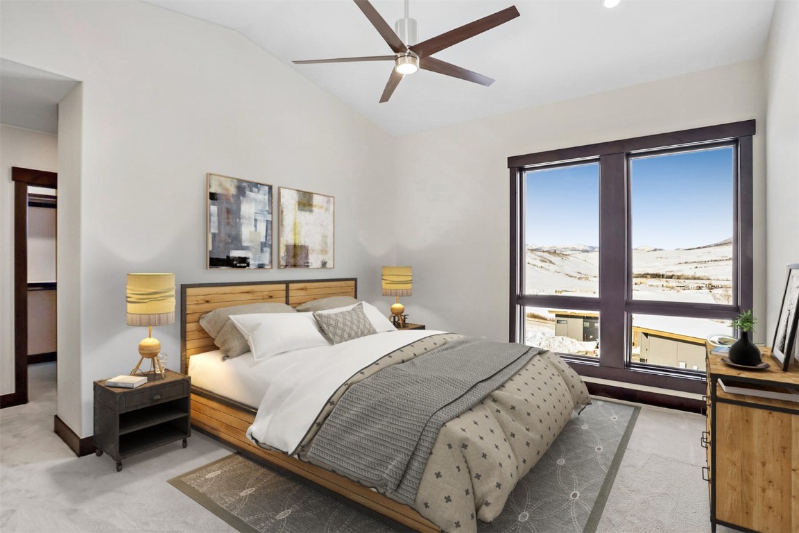 62 Vendette Road Silverthorne, CO 80498 - Photo 11 of 35 a bedroom with a bed and a large window