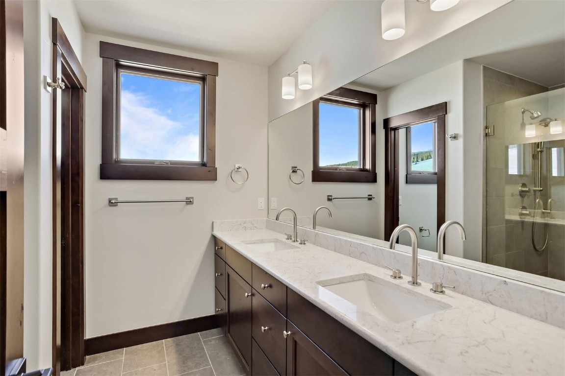 62 Vendette Road Silverthorne, CO 80498 - Photo 12 of 35 a bathroom with a sink vanity and mirror